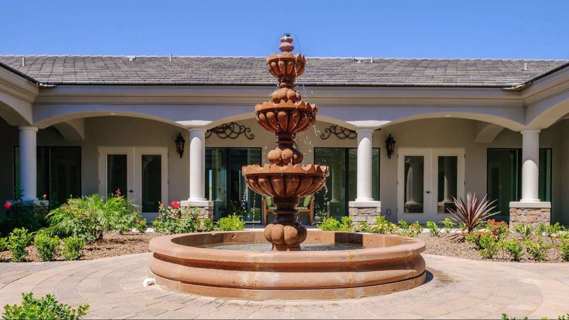 Peaceful waterfall in courtyard